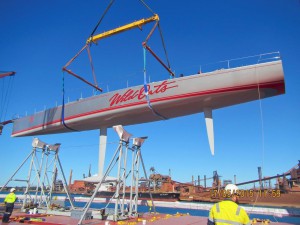 Flying high: Wild Oats XI is loaded onto aboard a special multi-purpose vessel bound for Los Angeles. 